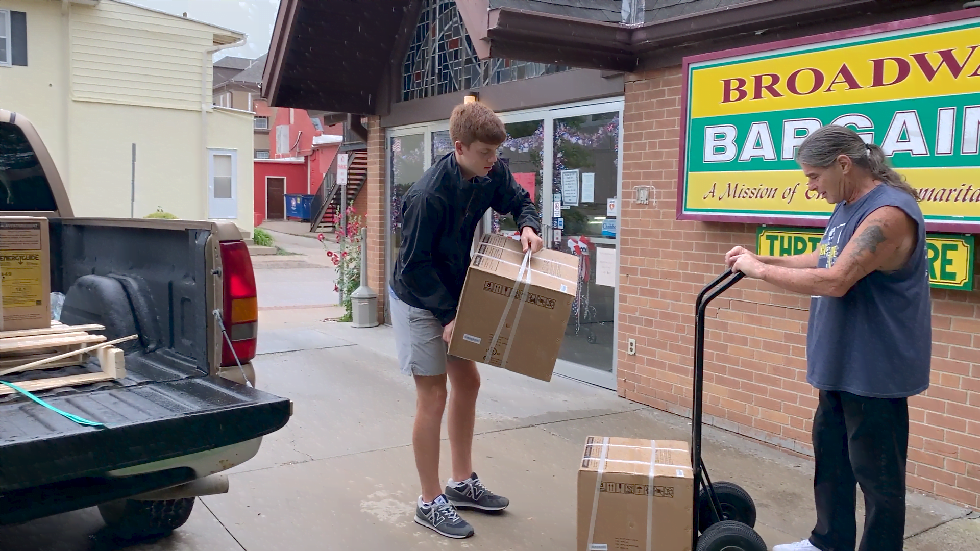 Ethan Edwards unloads AC units at the Good Samaritan Center