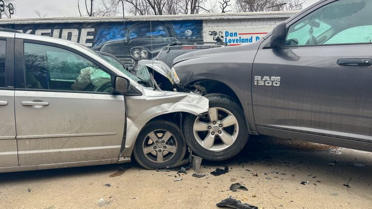 Minivan Crash at In and Out Auto Repair Results in Hospitalization and Multiple Totaled Vehicles