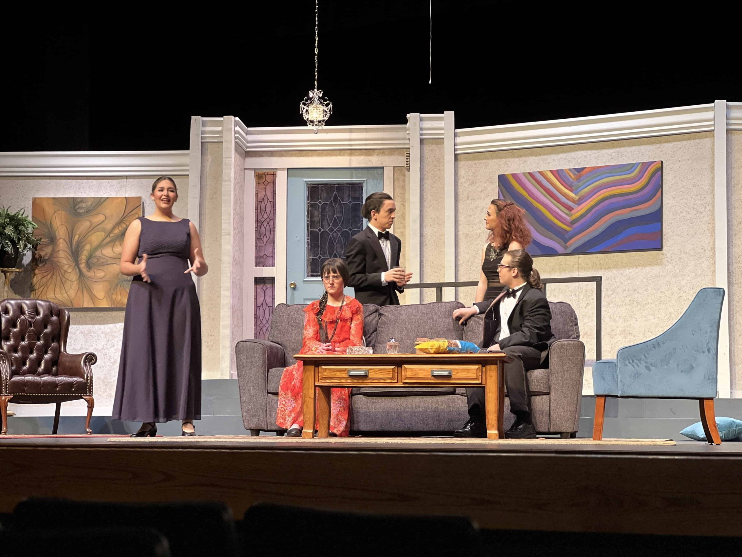 Actors onstage performing Neil Simon's "Rumors" play production at Excelsior Springs High School