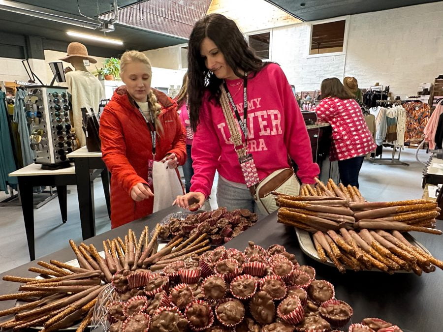 Two women pick out chocolates during the Chocolate Tour in downtown Excelsior Springs