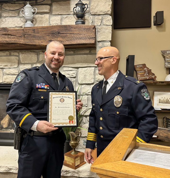 Lt Jeremiah Renne receives the Meritorious Award from Chief Gregory Dull