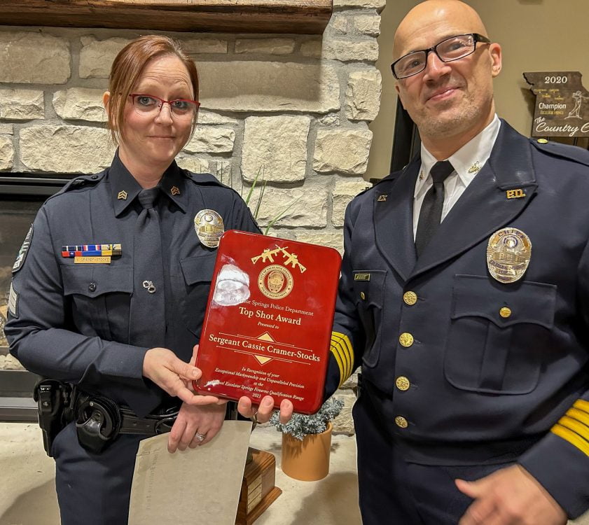 Sgt Cramer receiving the Top Shot Award from Chief Gregory Dull