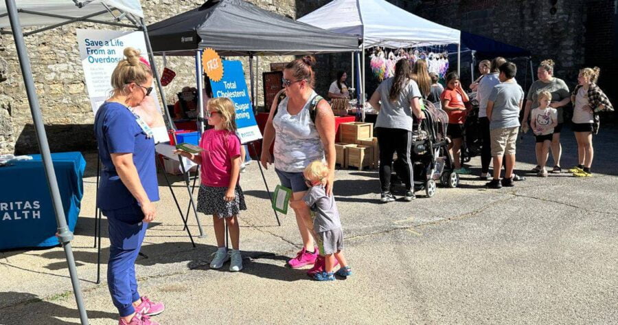 Excelsior Springs Farmers Market vendors talking to shoppers