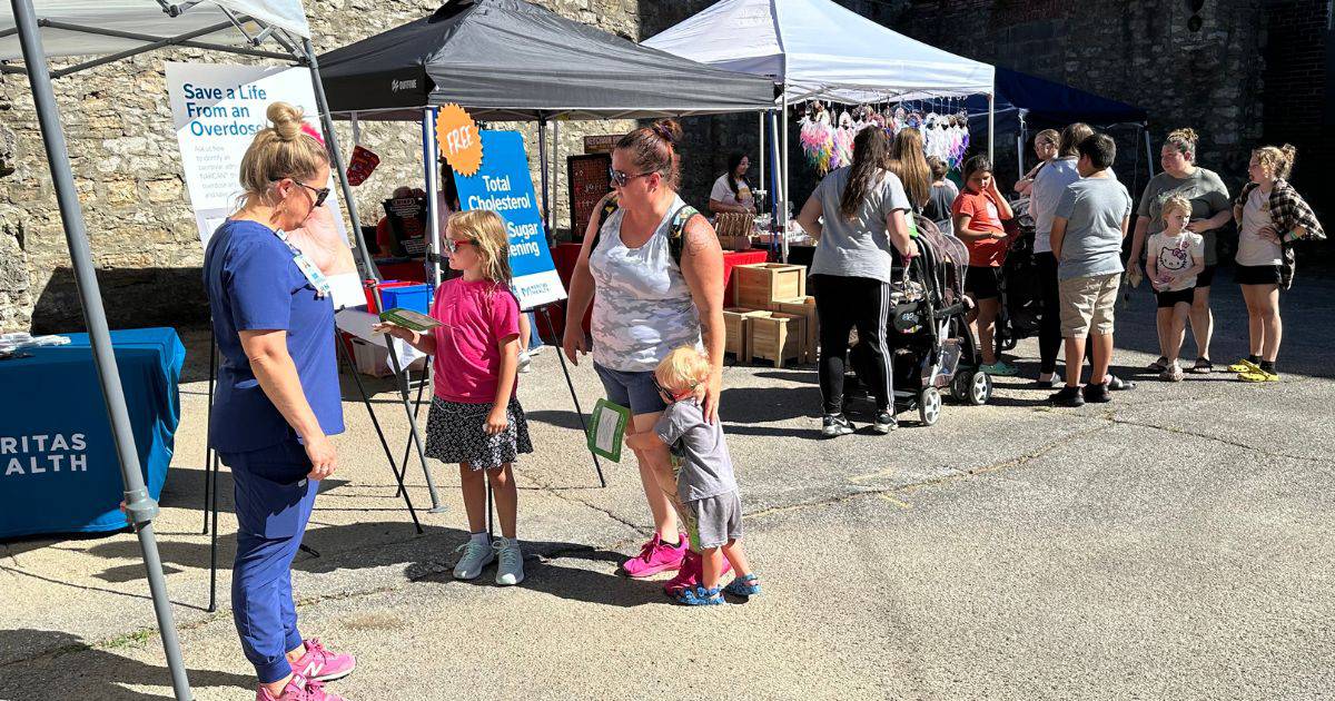 Excelsior Springs Farmers Market vendors talking to shoppers