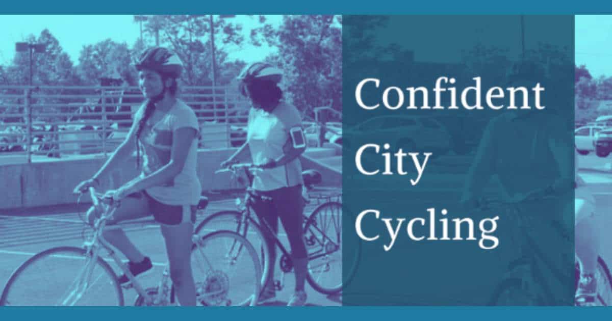 Confident City Cycling with two women bicycling in a parking lot