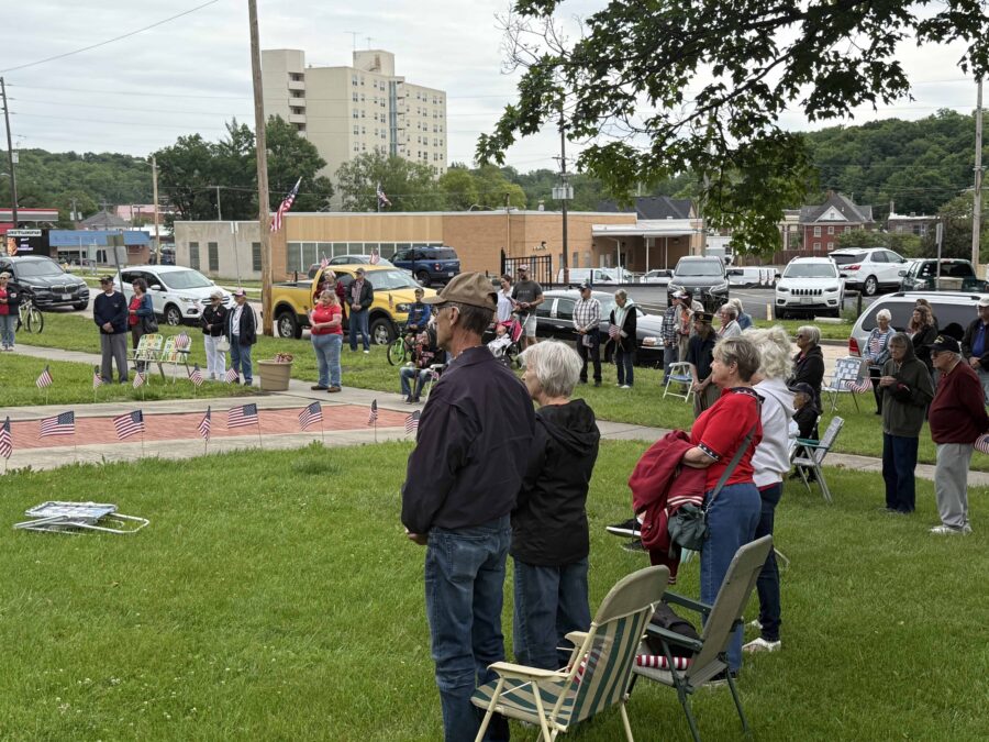 Attendees listen intently as Wetzel addresses them after the ceremony.