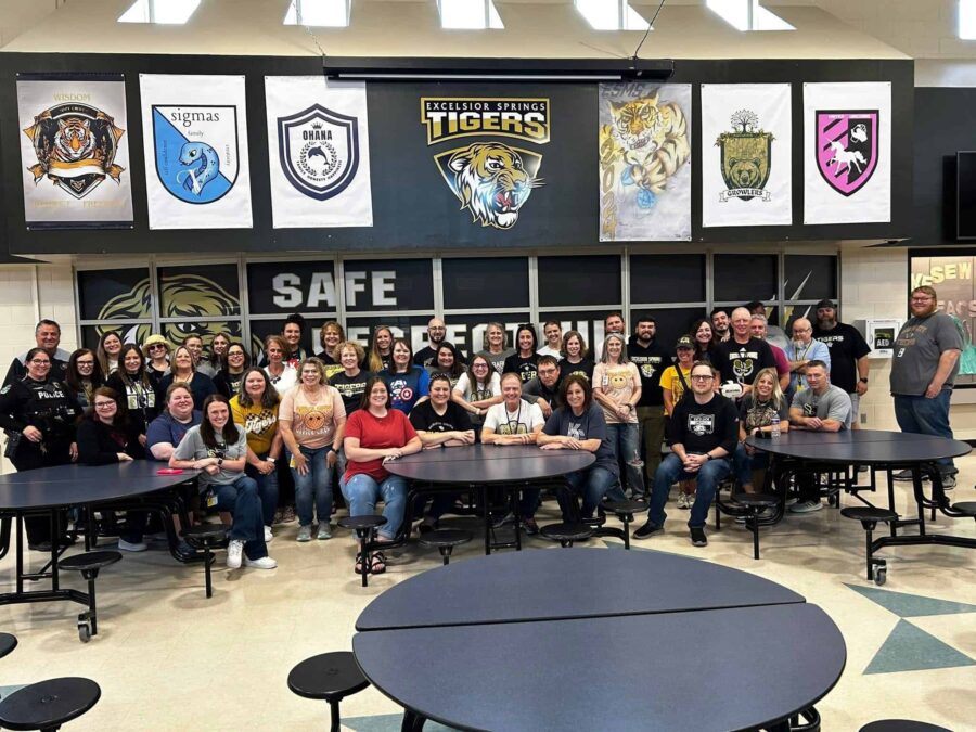 DiGirlamo poses with colleagues after being awarded by the Excelsior Springs Middle School.