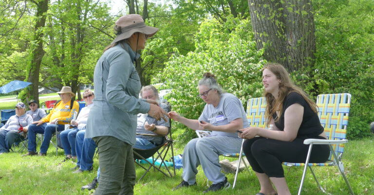 Elizabeth Parker shows those in attendance the finished charcoal before innoculation