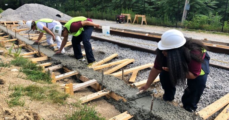 Excelsior Springs Job Corps cement masons learn how to lay a rail line