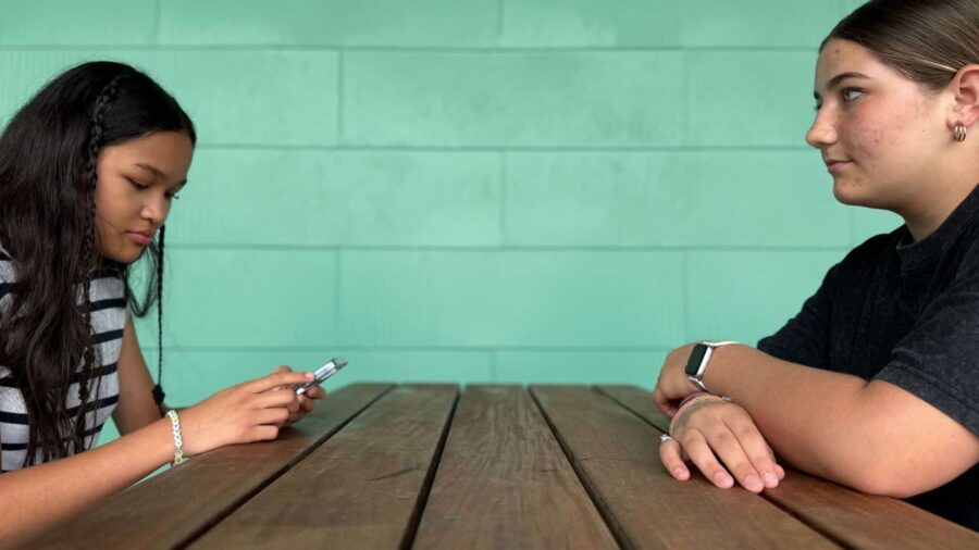 ESMS Students Juliana and Eden sit together while speaking about the potential cell phone ban.