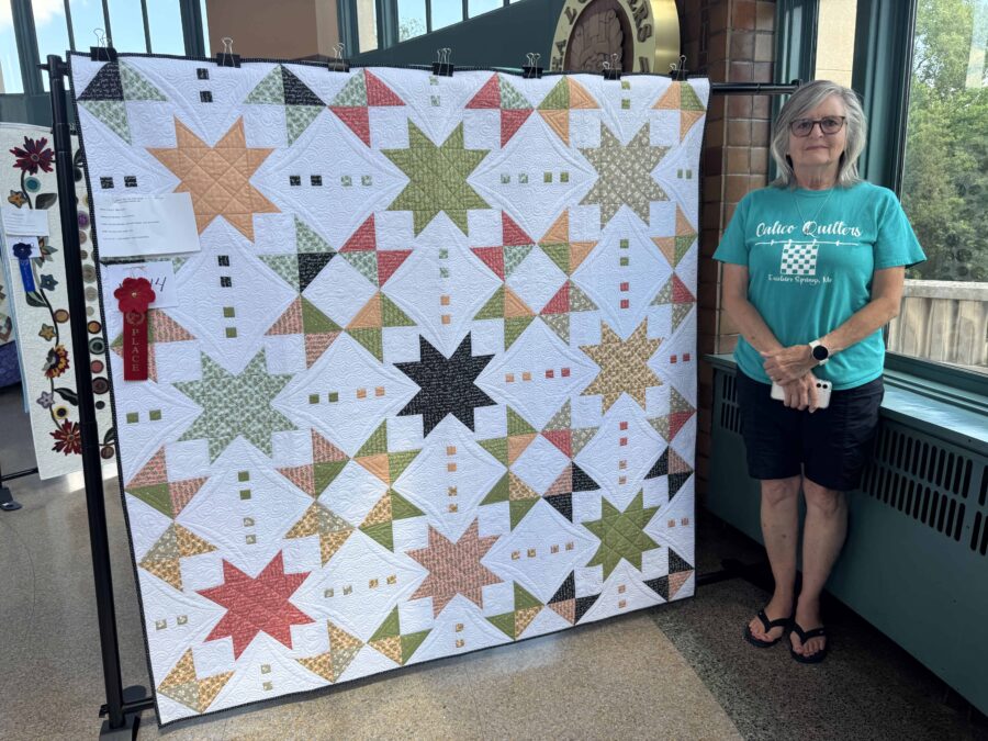 Paula Griffin with her award winning quilt